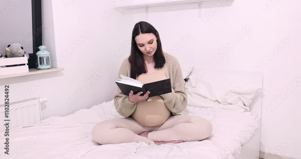 A Pregnant Woman Reading Comfortably on a Bed in a Cozy and Inviting Room Setting A Pregnant Woman Reading Comfortably on a Bed in a Cozy and Inviting Room Setting
