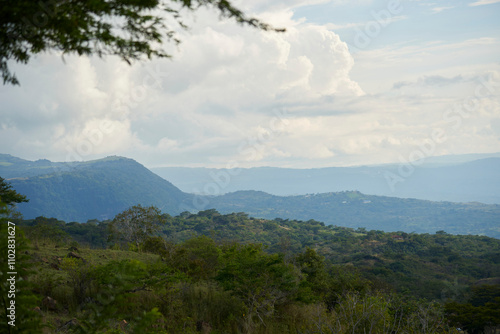 Colombian Andean landscape, layers of mountains covered with lush, green vegetation. View from a lookout point in Guane, Santander. photo