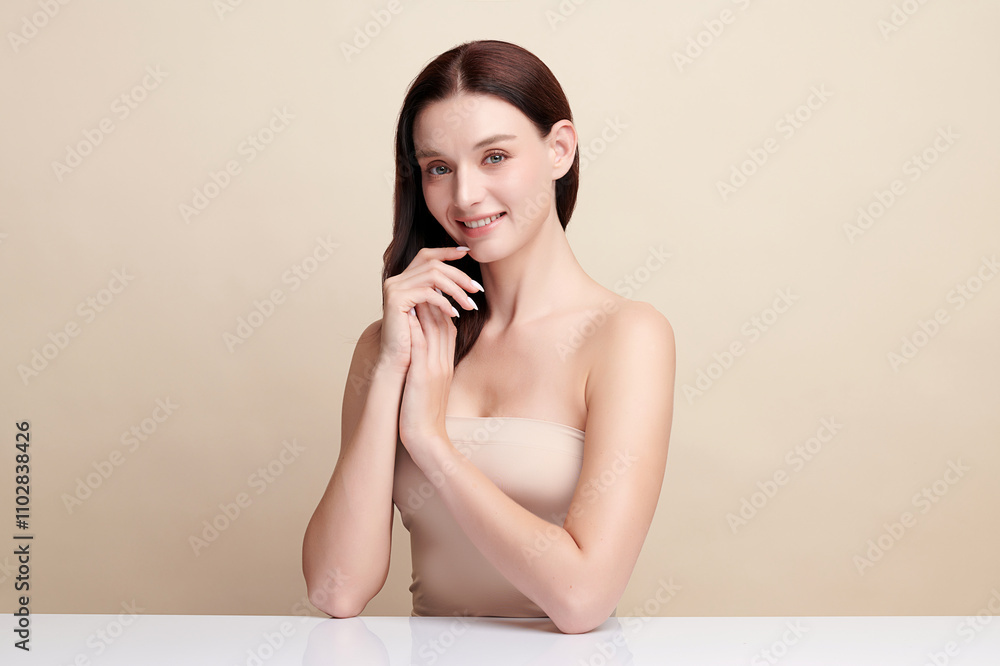 Obraz premium Beautiful young woman with clean fresh skin on beige background, Face care, Facial treatment, Cosmetology, beauty and spa, women portrait.