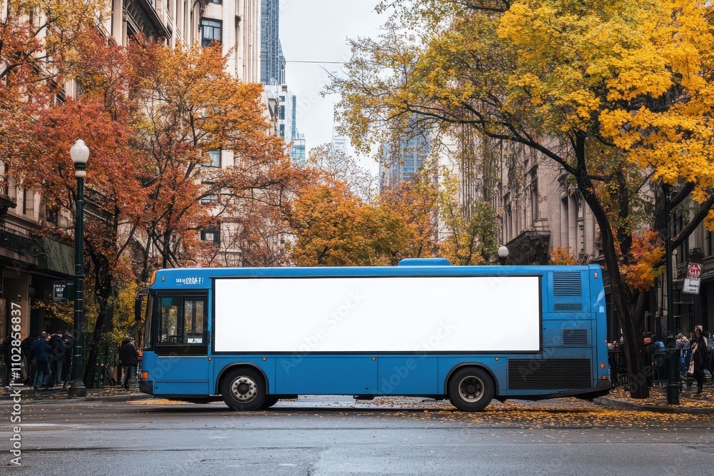 Obraz premium A blue bus parked on a city street with a blank white advertisement space on its side