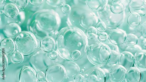 Abstract image of numerous bubbles floating in clear turquoise sea water.