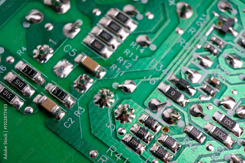 The back side of an electronic circuit board with connecting tracks close-up The back side of an electronic circuit board with connecting tracks close-up