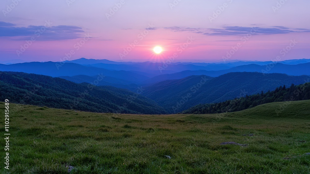 Obraz premium Serene Sunset Landscape Majestic Mountains Grassland Peaceful Sky
