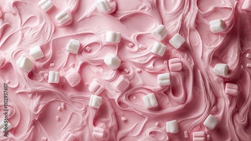 A pink, creamy texture with scattered white marshmallows, suggesting a dessert or treat.