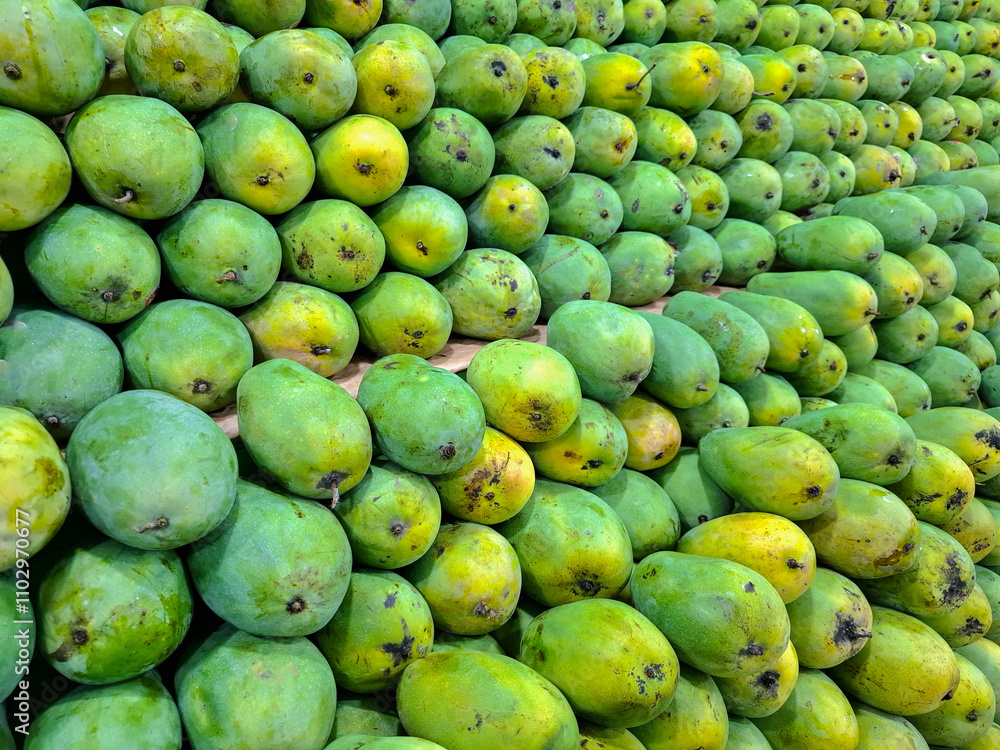 background with piles of mangoes on display and for sale background with piles of mangoes on display and for sale