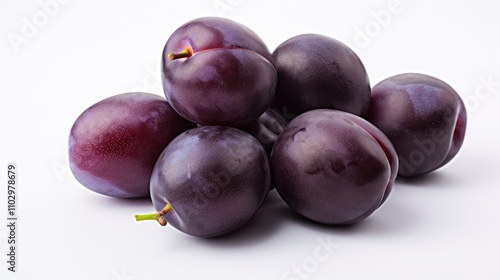 Fresh plums piled elegantly on a pristine white background showcasing their rich color and natural shine ideal for food-related projects.