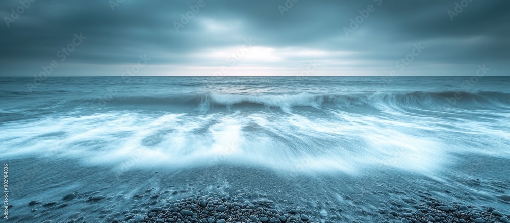 Tranquil gray blue horizon with gentle waves lapping at stones creating a serene coastal atmosphere suitable for relaxation and meditation. Tranquil gray blue horizon with gentle waves lapping at stones creating a serene coastal atmosphere suitable for relaxation and meditation.