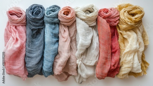 Linen scarves arranged in a row showcasing a vibrant color palette on a clean white background photo