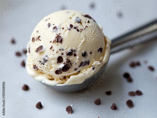 A delicious scoop of chocolate chip ice cream, perfect for a sweet treat or dessert. Enjoy this delightful creamy dessert anytime. photo