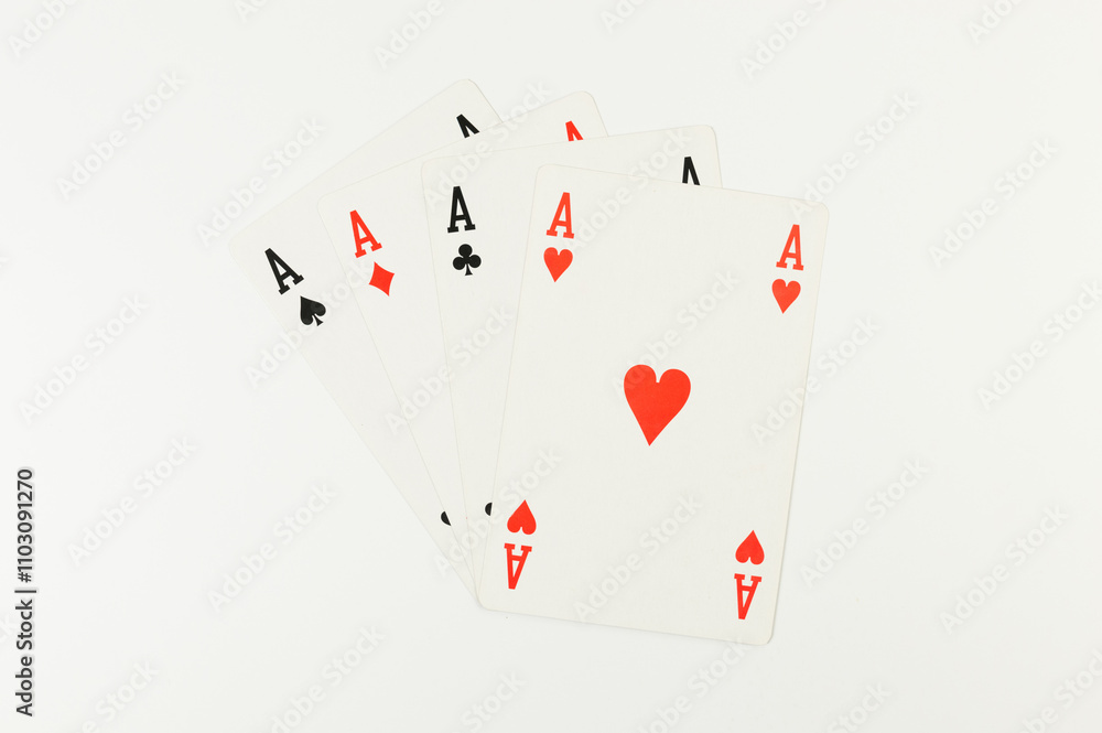Top view of playing cards on white background. Four aces cards, board game, poker. Copy space, flat lay. Top view of playing cards on white background. Four aces cards, board game, poker. Copy space, flat lay.