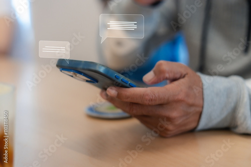 Close up man using smart phone, Social media marketing concept. hand using smartphone typing, chatting conversation in chat box icons pop up photo