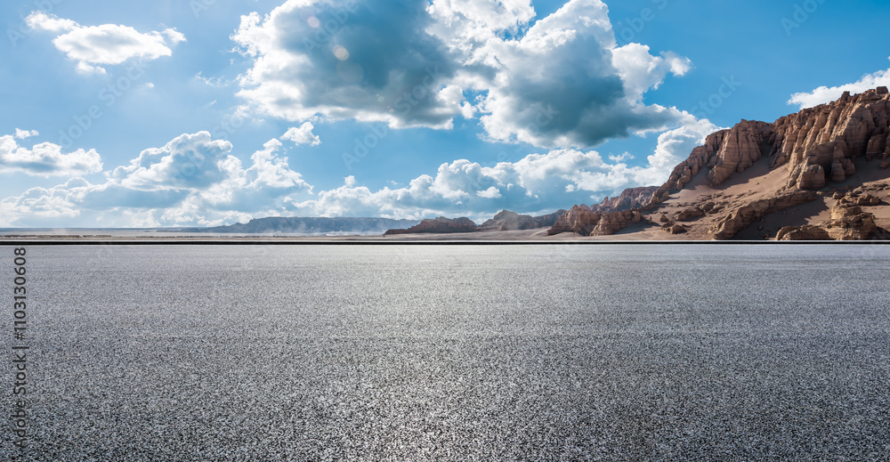 Asphalt road and Yardang landform mountain natural landscape in Xinjiang, China. Outdoor natural background.