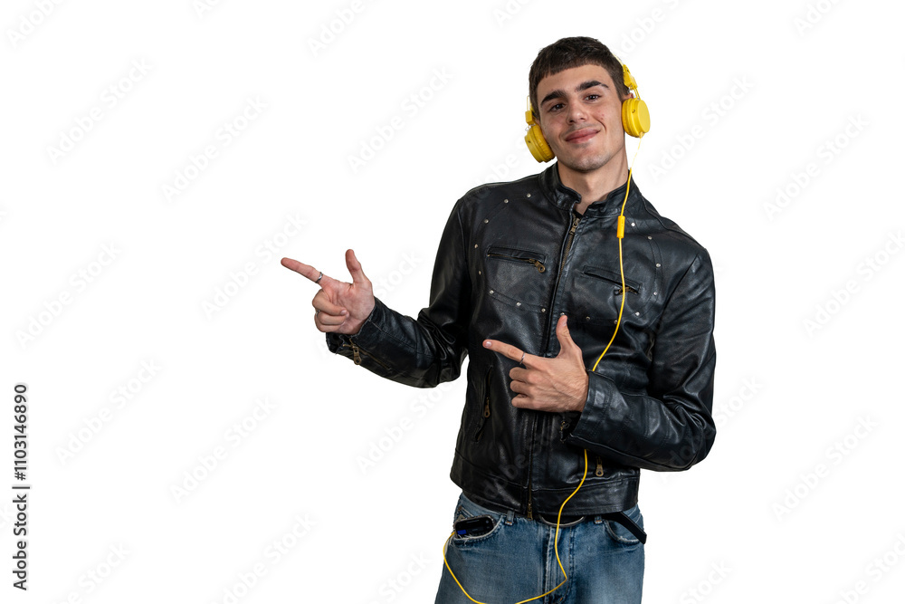 Young disc jockey wearing headphones is pointing to the left with index fingers Young disc jockey wearing headphones is pointing to the left with index fingers