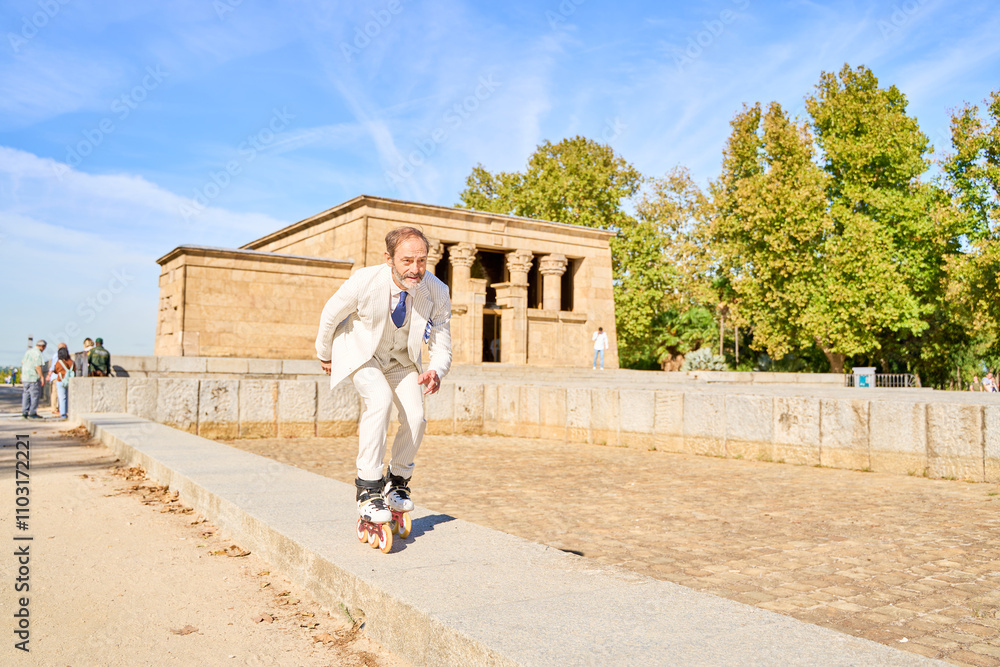 Man roller skating near the Temple of Debod on a sunny day Man roller skating near the Temple of Debod on a sunny day