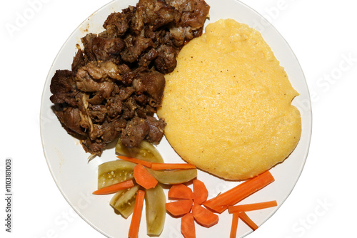 Cauldron cooked lamb pastrami with polenta and pickles. Traditional romanian food photo