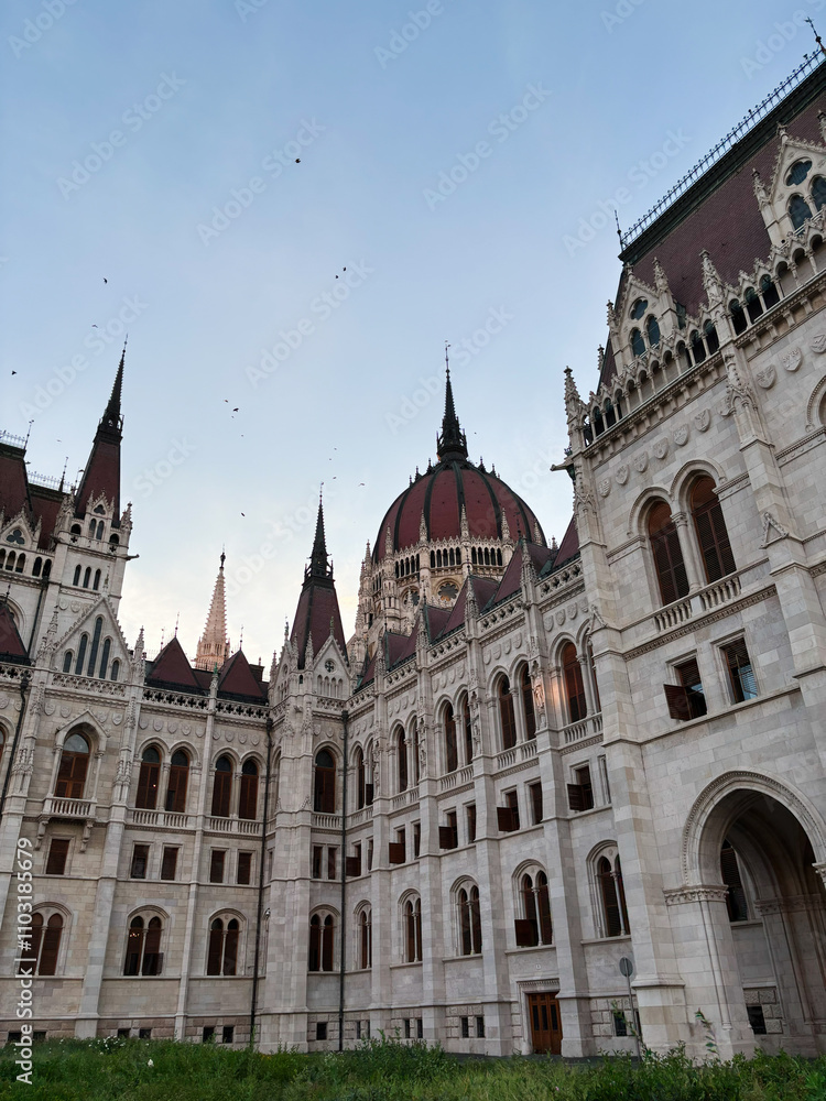 Majestic architecture of a historic European parliament building at sunset. Hungarian Parliament Building.