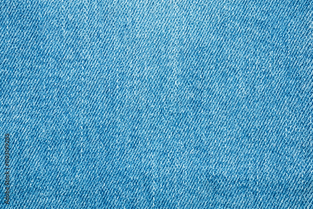 Old denim blue jeans fabric texture background Old denim blue jeans fabric texture background