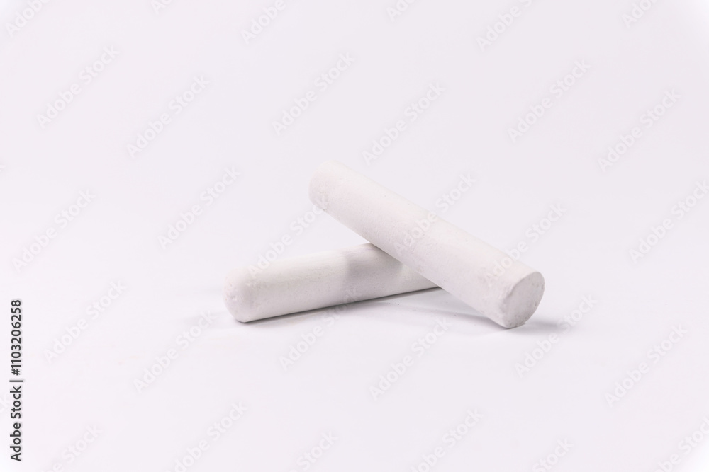 Fototapeta premium White chalks on a white background. Education