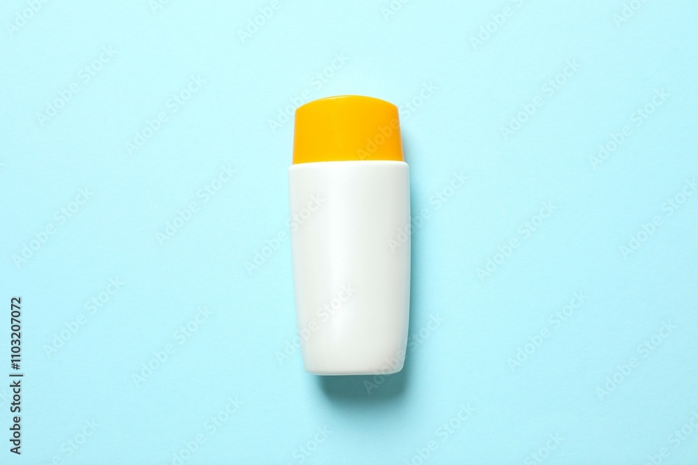 Top view of SPF skin care bottle on colored background Top view of SPF skin care bottle on colored background