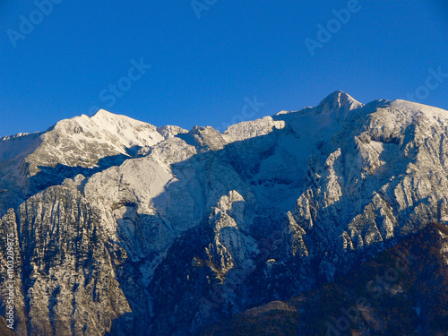 View of the snow-covered Monte Baldo peaks, on the left, Punta Pettorina 2192m and on the right, Cima Telegrafo 2200m. photo