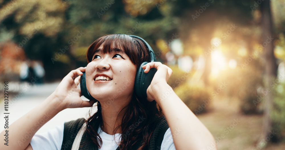 Woman, headphones and student travel or thinking in city, streaming playlist and online for listening. Female person, outdoor and hearing sound on journey in Japan, university campus and planning Woman, headphones and student travel or thinking in city, streaming playlist and online for listening. Female person, outdoor and hearing sound on journey in Japan, university campus and planning