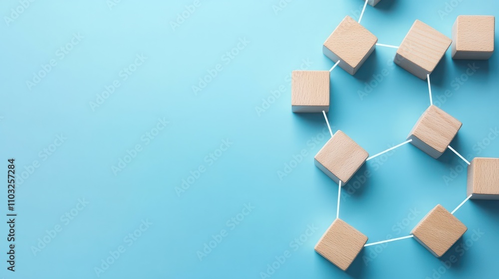 Wooden blocks connected together on a blue background. Teamwork concept Wooden blocks connected together on a blue background. Teamwork concept