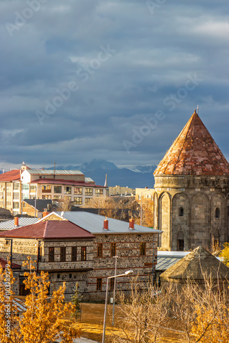 Erzurum historical stone houses and tomb under a dramatic sky in Turkey.