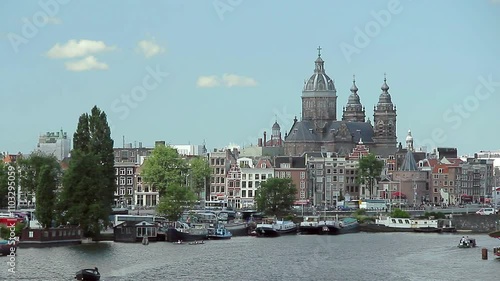 Partial view of Amsterdam with St Nicolas church towering above the buildings. Amsterdam, The Netherlands.