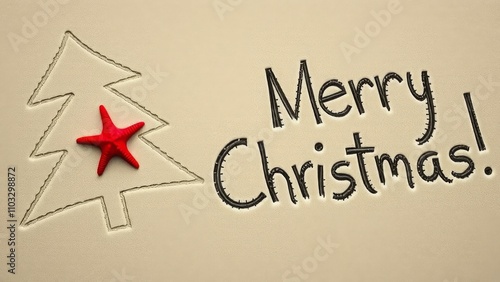 Abstract drawing of a Christmas tree scratched on the sand on the beach by the ocean and red starfish and English Merry Christmas words photo