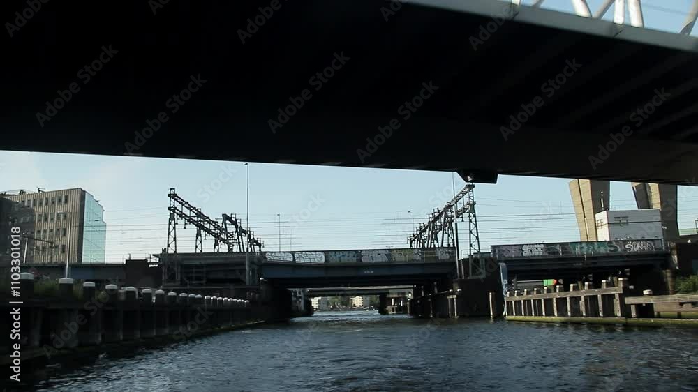 Sailing through Amsterdam's modern area. Holland Sailing through Amsterdam's modern area. Holland