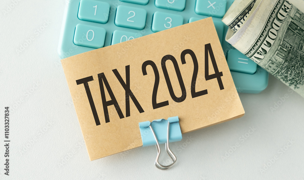 TAX 2024 . Value Added Tax Concept. text on page near white keyboard and calendar TAX 2024 . Value Added Tax Concept. text on page near white keyboard and calendar