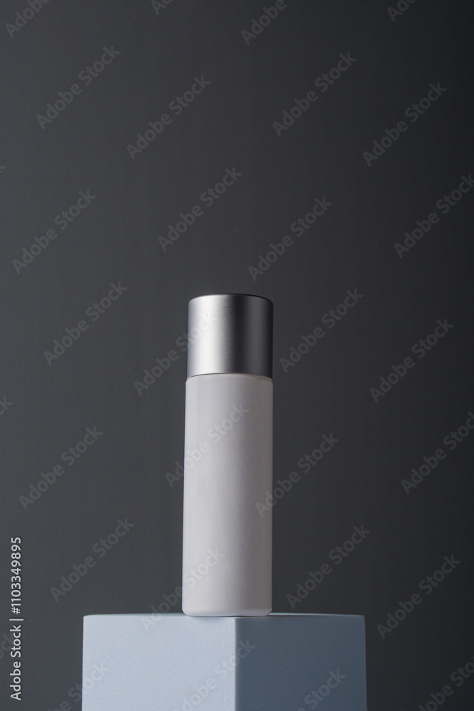White sunscreen bottle on grey background. Sunscreen concept. Skin care concept. Copy space. White sunscreen bottle on grey background. Sunscreen concept. Skin care concept. Copy space.