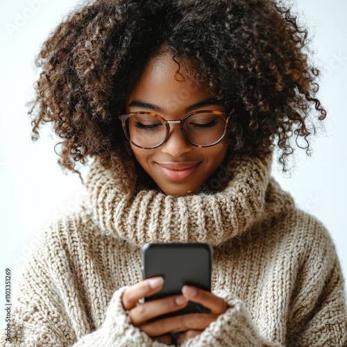 A stunning young black woman, phone in hand, on a clear background.