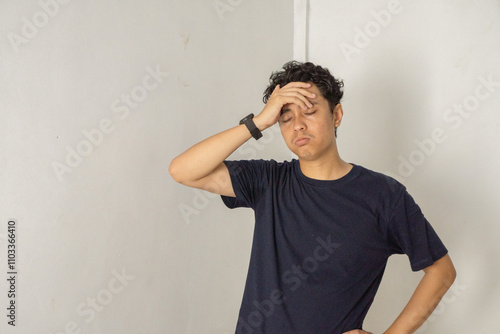 Man Holding His Head, Tired