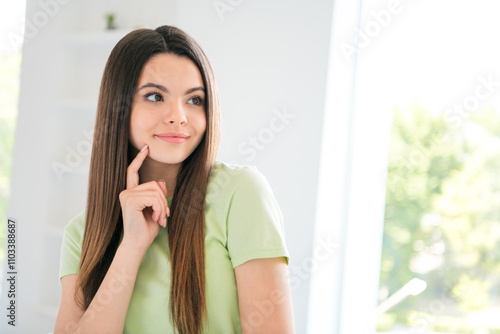 Young woman with brunette hair pondering in a bright kitchen, wearing a casual t-shirt, enjoying the leisure of daytime indoors Free Download Young woman with brunette hair pondering in a bright kitchen, wearing a casual t-shirt, enjoying the leisure of daytime indoors - GFXLoad