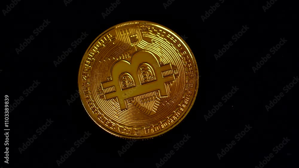 Golden Bitcoin coin spinning against a black background, showcasing intricate details and elegant texture. Perfect for cryptocurrency, blockchain, or finance-related visual projects. Flatlay. Golden Bitcoin coin spinning against a black background, showcasing intricate details and elegant texture. Perfect for cryptocurrency, blockchain, or finance-related visual projects. Flatlay.