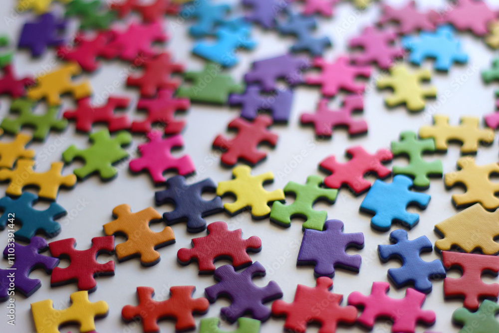 Colorful jigsaw puzzle pieces on white background. Selective focus. Colorful jigsaw puzzle pieces on white background. Selective focus.