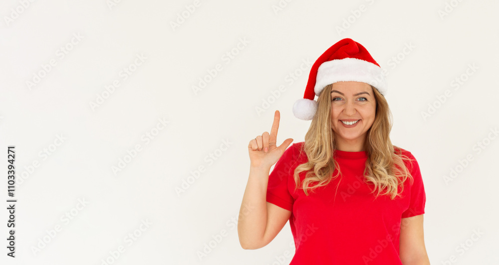 Young insighted proactive woman wears Christmas red hat holding index finger up with new idea isolated on white background studio portrait. Happy New Year 2025 celebration concept Young insighted proactive woman wears Christmas red hat holding index finger up with new idea isolated on white background studio portrait. Happy New Year 2025 celebration concept