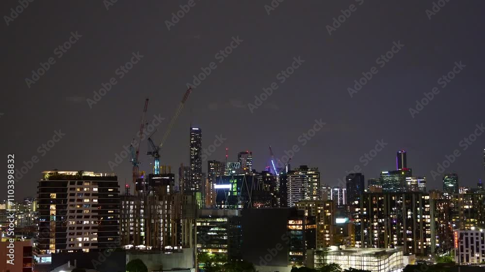 Wild weather sweeps through south-east and central Queensland, night time-lapse shot capturing the dark, ominous sky filled with thunder and lightning strikes, set against Brisbane cityscape. Wild weather sweeps through south-east and central Queensland, night time-lapse shot capturing the dark, ominous sky filled with thunder and lightning strikes, set against Brisbane cityscape.