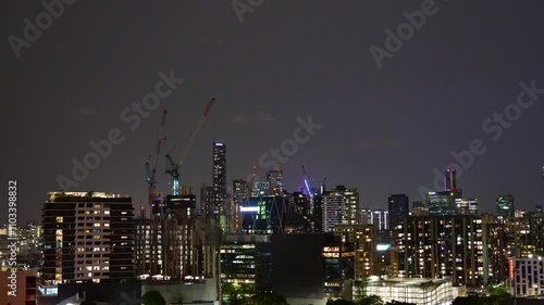 Wallpaper Mural Wild weather sweeps through south-east and central Queensland, night time-lapse shot capturing the dark, ominous sky filled with thunder and lightning strikes, set against Brisbane cityscape. Torontodigital.ca
