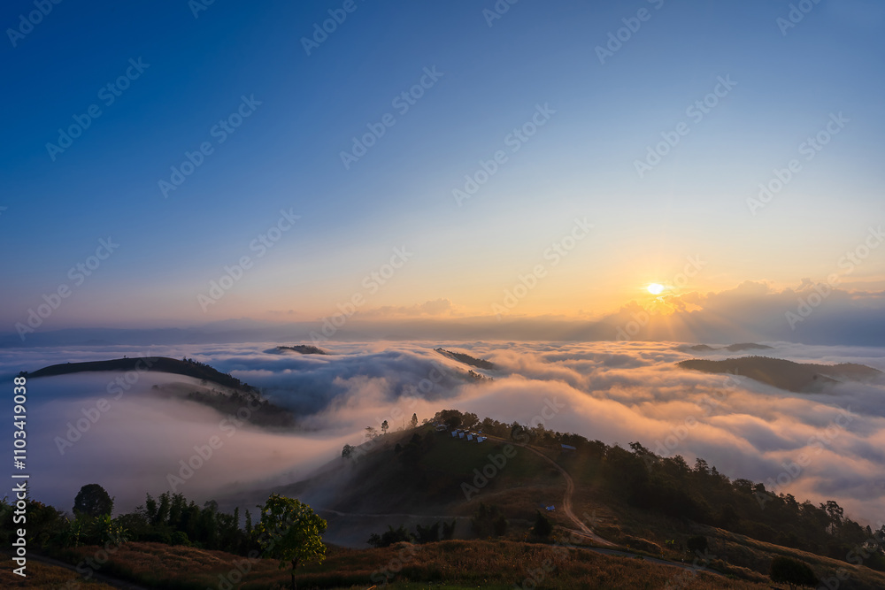 Obraz premium Beautiful scenery of the Po ku de viewpoint a sea of mist in the morning with the movement of the fog covering the Mountain. Tourism enjoy the natural beauty Mae Chaem, Chiang Mai, Thailand.