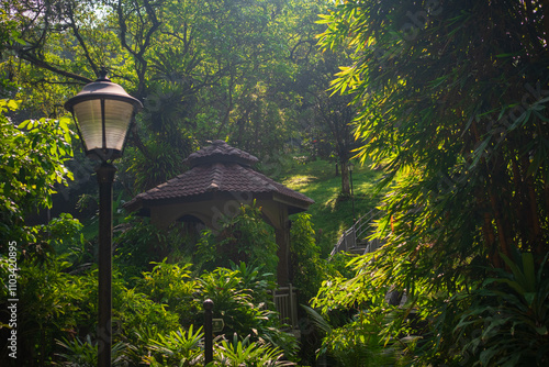 Canvas Print Infrastructure of the Kuala Lumpur Perdana Botanical Garden featuring walking paths, benches, decorative bridges, and well-maintained facilities integrated into the lush tropical environment
