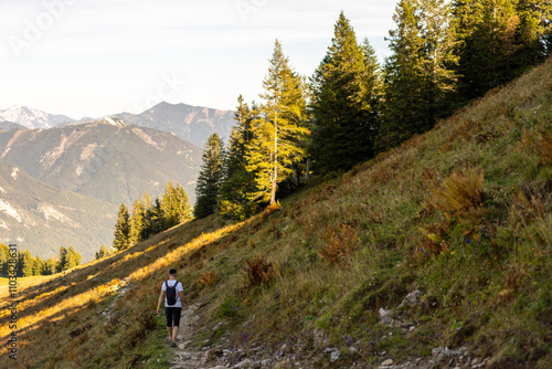 Hiking man in the mountains photo