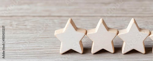 Three wooden stars arranged on a rustic wooden surface, perfect for decoration or artistic projects, on a neutral backdrop.