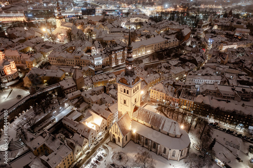 Aerial night View of Tallinn in winter, roofs are covered with snow, Christmas mood