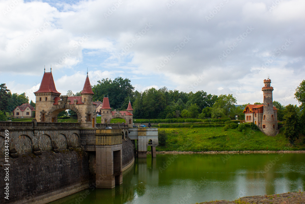 Fototapeta premium architectural structure, ancient dam with arches and red roofs in the Czech town of Hradec Králové