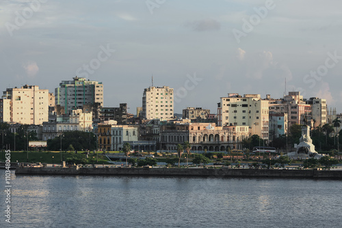 Panoramic view of Havana’s waterfront with buildings and greenery during a sunny day