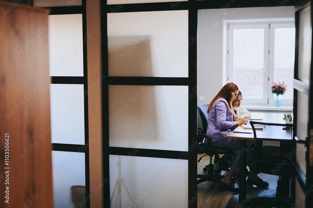 Schoolgirl and teacher have a lesson in the office, private lessons, distance learning Schoolgirl and teacher have a lesson in the office, private lessons, distance learning