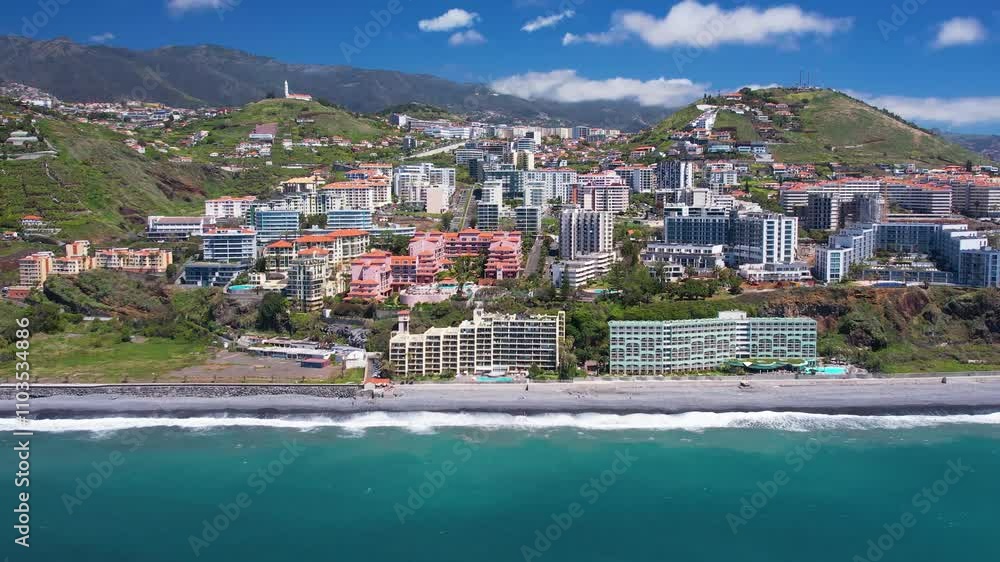 Aerial view of turquoise waters of Praia Formosa beach and colorful houses and hotels on hills in Funchal Madeira island Portugal Aerial view of turquoise waters of Praia Formosa beach and colorful houses and hotels on hills in Funchal Madeira island Portugal