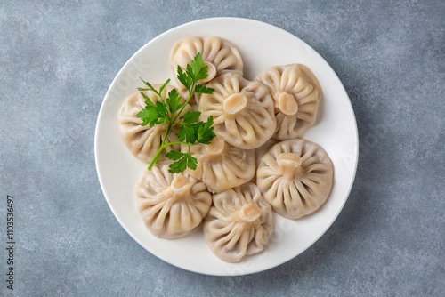 Obraz na płótnie Traditional Georgian dish khinkali - Hinkali - Boiled khinkali with lamb or beef or cheese w salonie